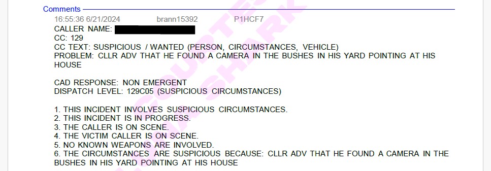 JP calls to report a camera in the bushes pointed towards his house.